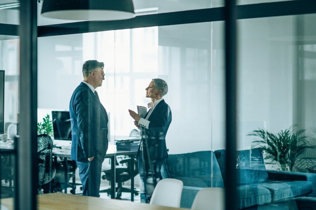 Business couple discussing important documentation